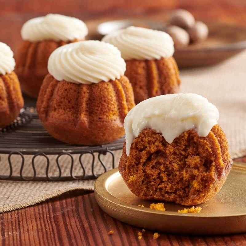 Pumpkin Spice flavor, mini Bundt cakes crowned with cream cheese - Shop Bundtinis
