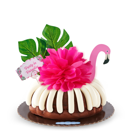Bundt cake with hot pink bow, Party in Paradise card, and festive flamingo.