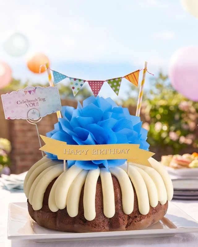 Happy Bundt Day cake with birthday-themed decorations.