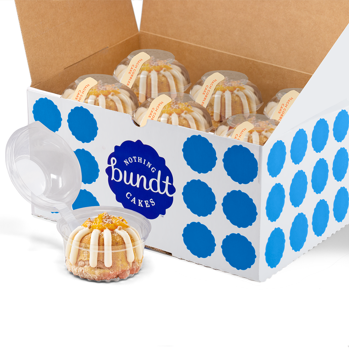 12 individually packaged Peach Cobbler Cake Bundtlet gift wrapped in cellophane with a blue stitched ribbon.