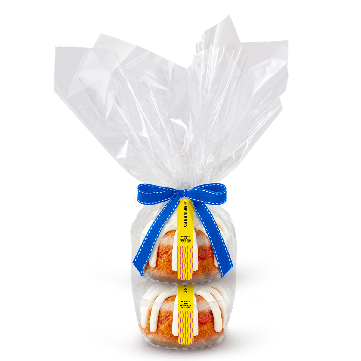 Two individually packaged Cinnamon Cake Bundtlet gift wrapped in cellophane with a blue stitched ribbon.