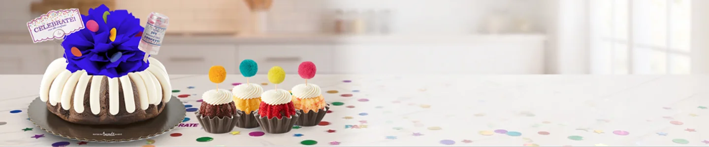 Celebrate Bundt Cake with a navy bow and Confetti Pom Poms Bundtinis®.
