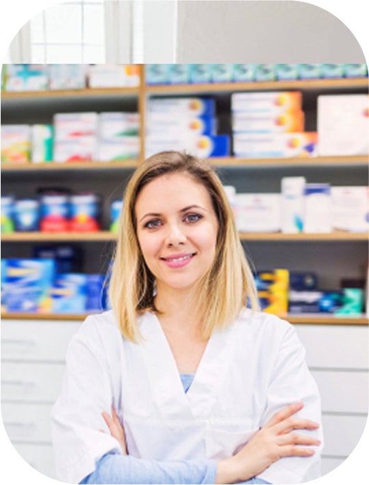 A female pharmacist smiling.