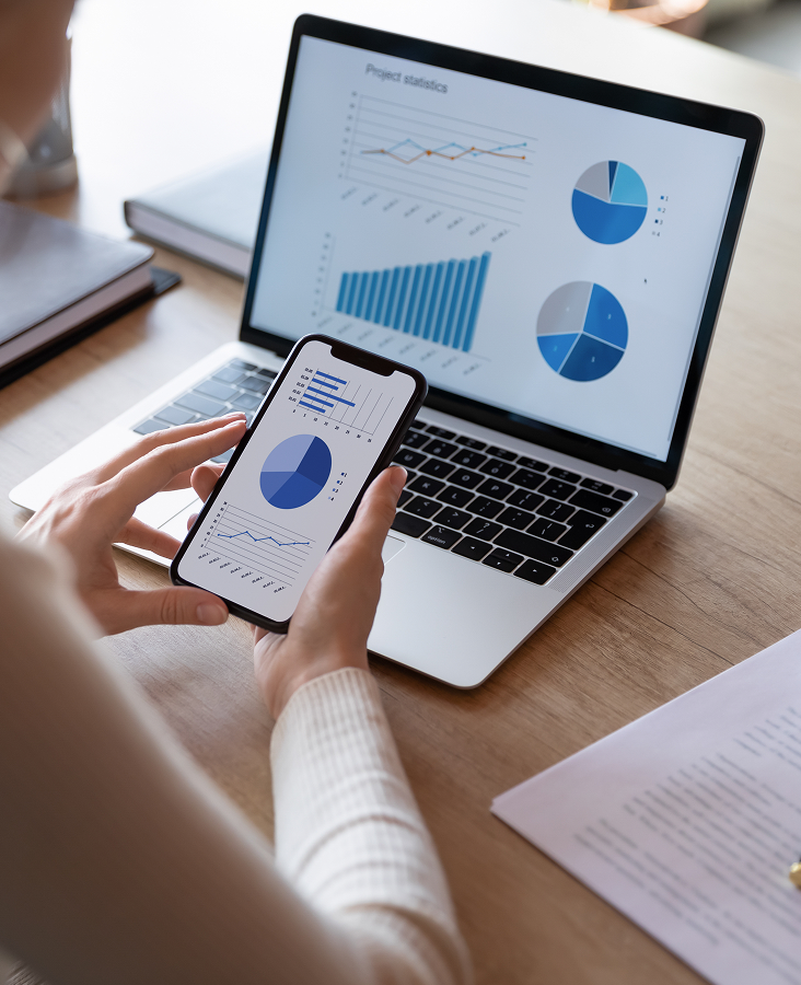 A business professional engaging with a mobile app to optimize business strategies and performance.