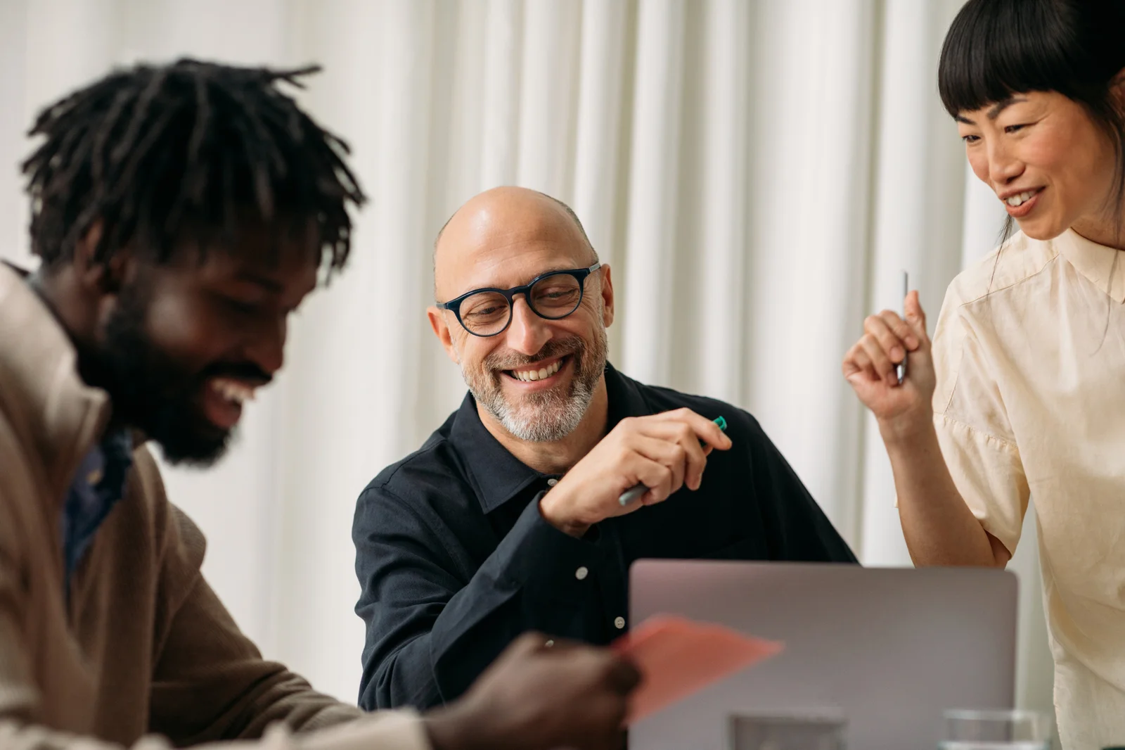 People smiling during a business meeting