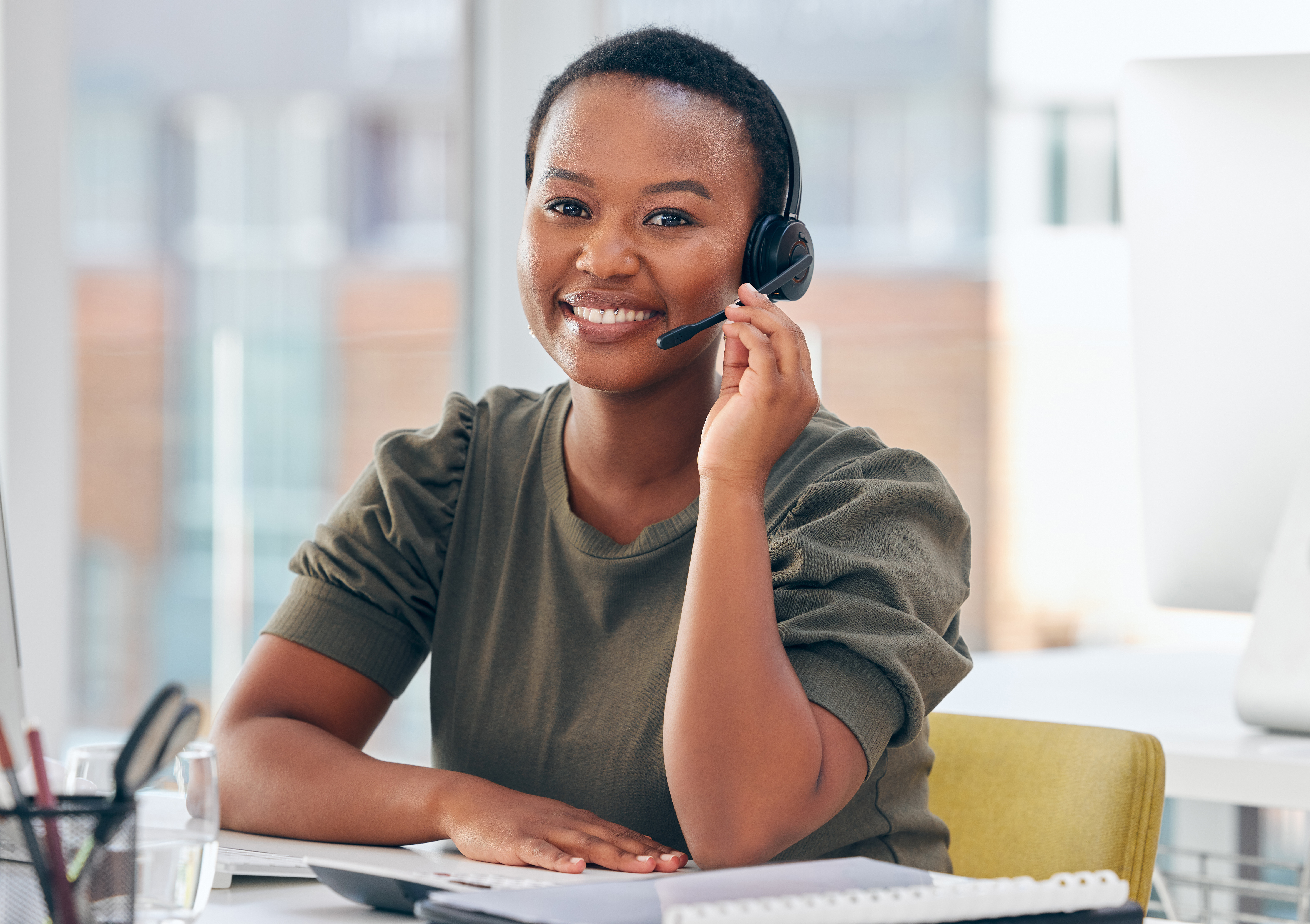 Smiling customer service agent with a headset