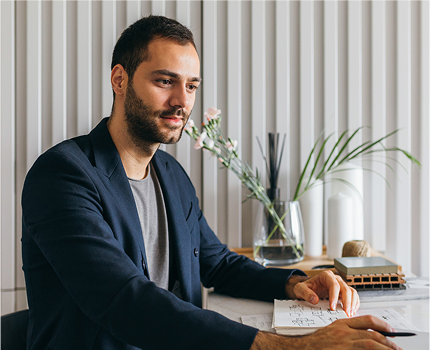 A man working from home at his desk. 