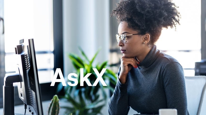 Woman on office computer using Amplity AskX.