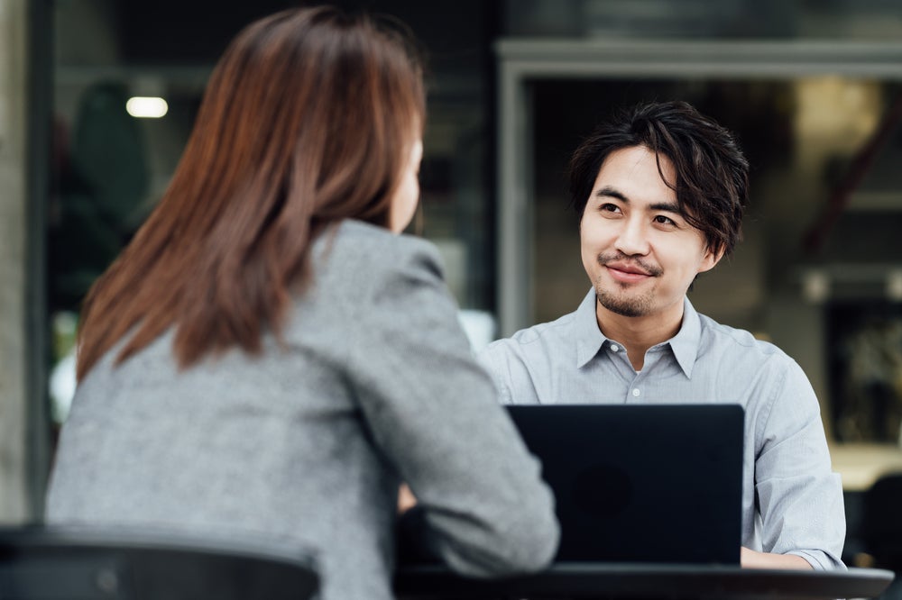 A man and a woman having a business meeting.