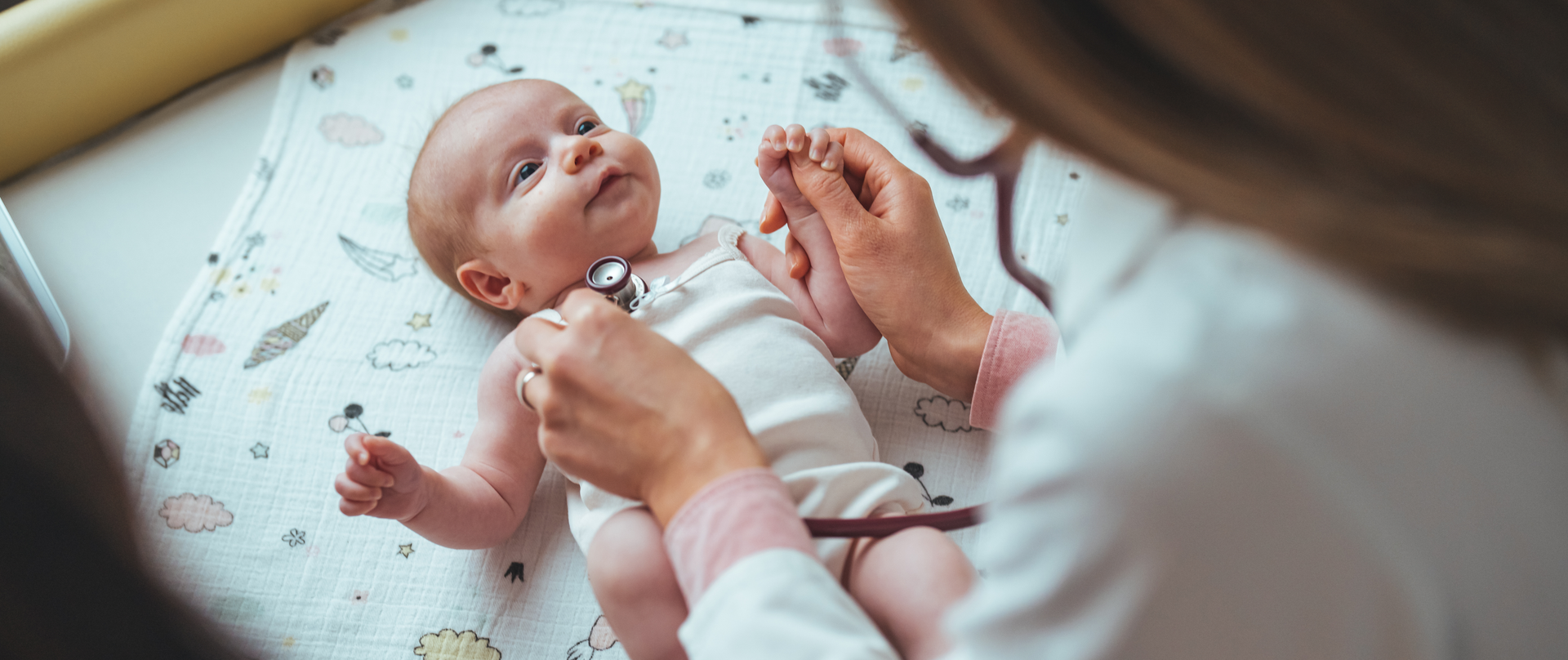 Doctor checking baby’s heart rate