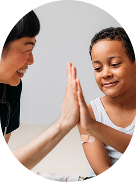 A woman and a child enthusiastically giving each other high fives, capturing a delightful moment of shared joy.