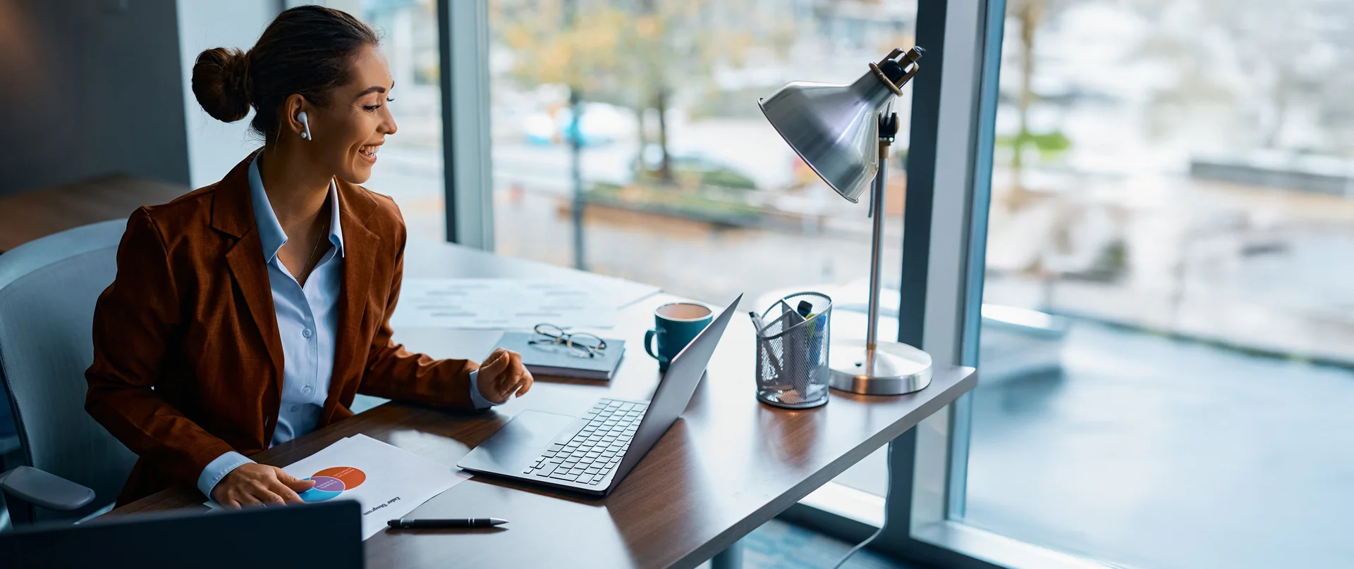 A remote sales representative on a video call with an HCP engaged in a productive conversation with visible medical charts or documents on the screen.