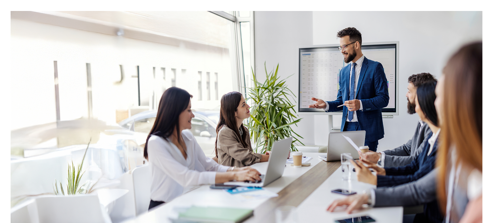 A man is giving a presentation to a group of people