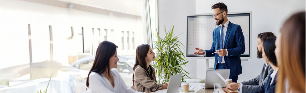 A man is giving a presentation to a group of people