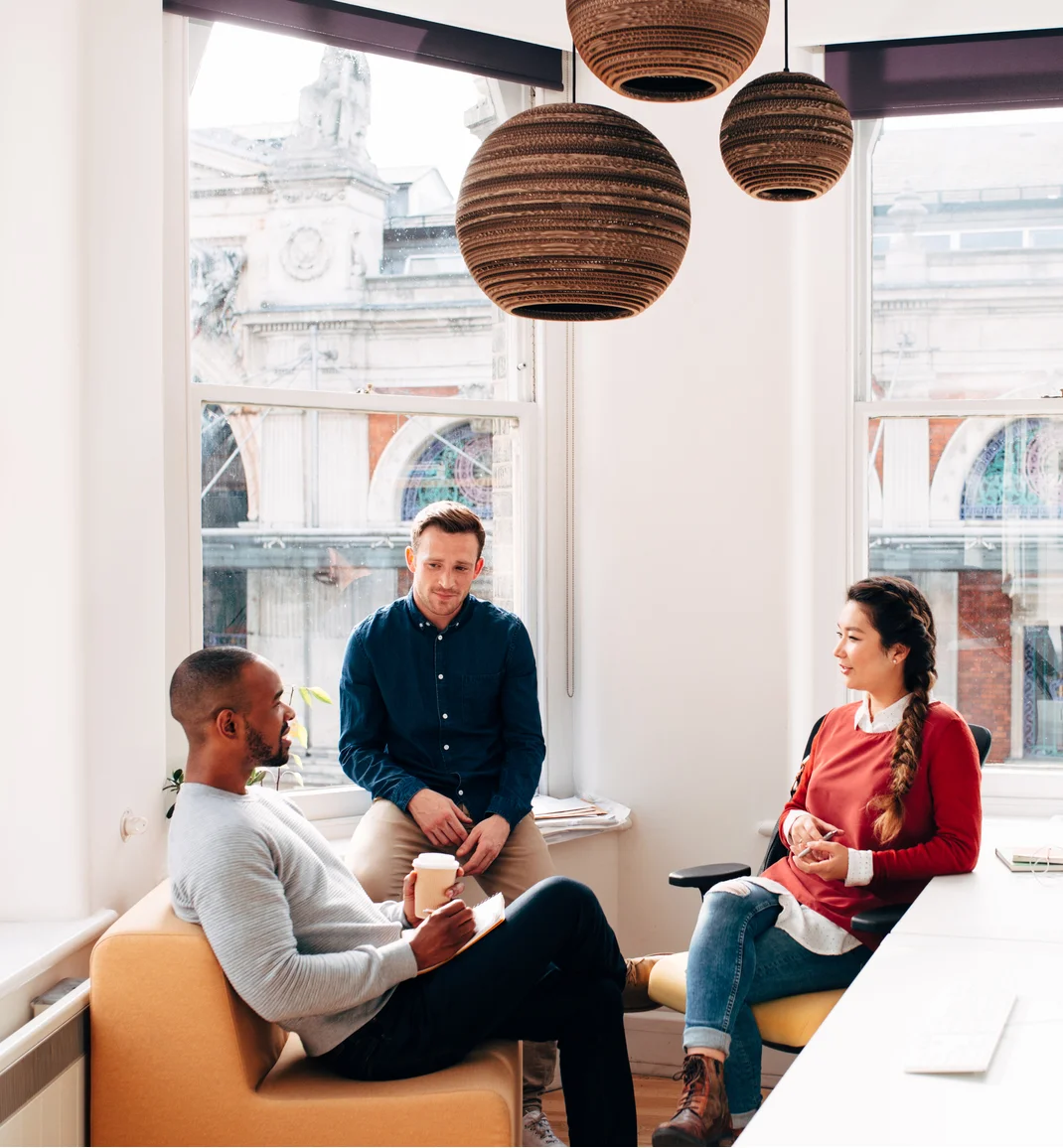 A group of people in a casual meeting at the office.