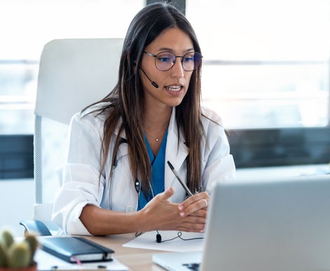 Nurse educator talking on a headset.