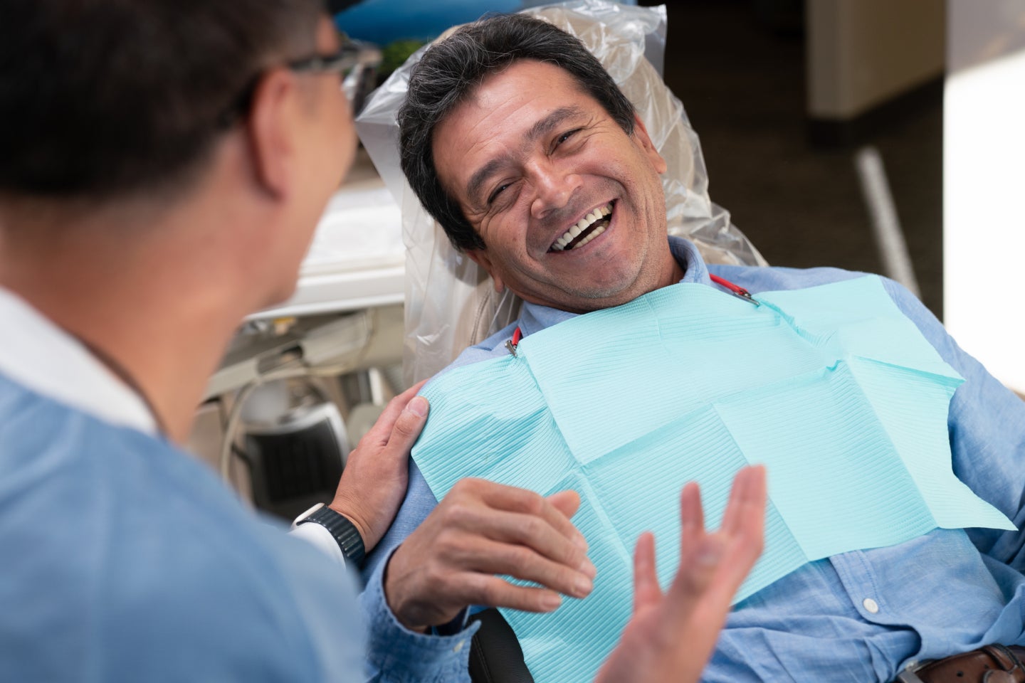 A patient and ClearChoice doctor discussing the types of dental done grafts.