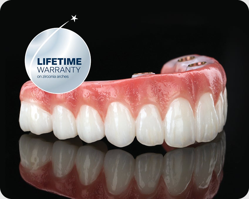 Close up of zirconia dental implant arches with a ClearChoice lifetime warranty badge. Highlights durability and long term peace of mind.