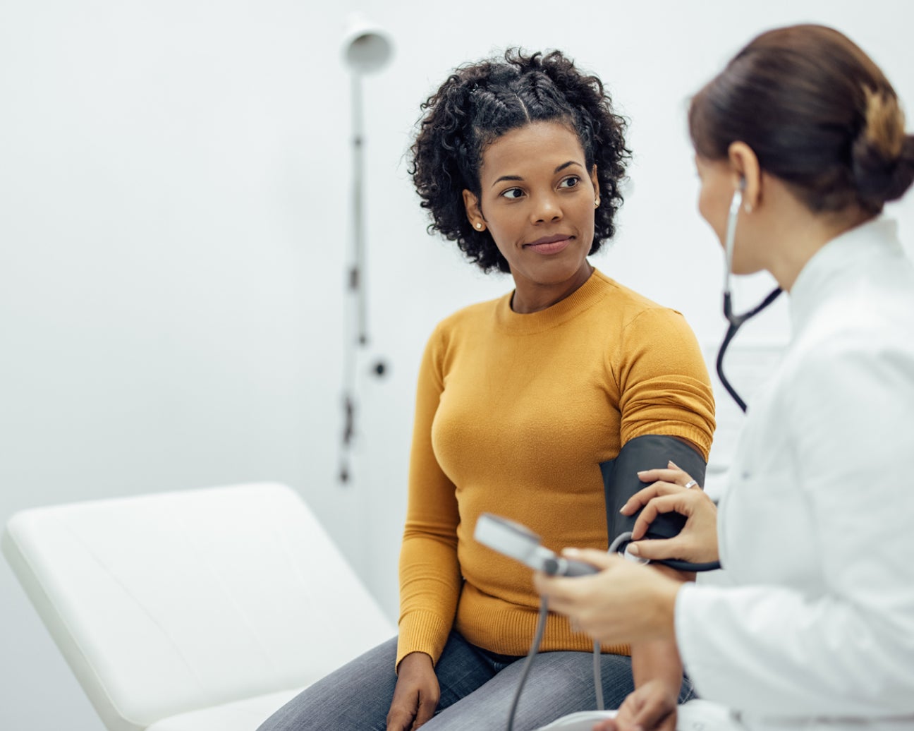 A medical provider examining a patient.