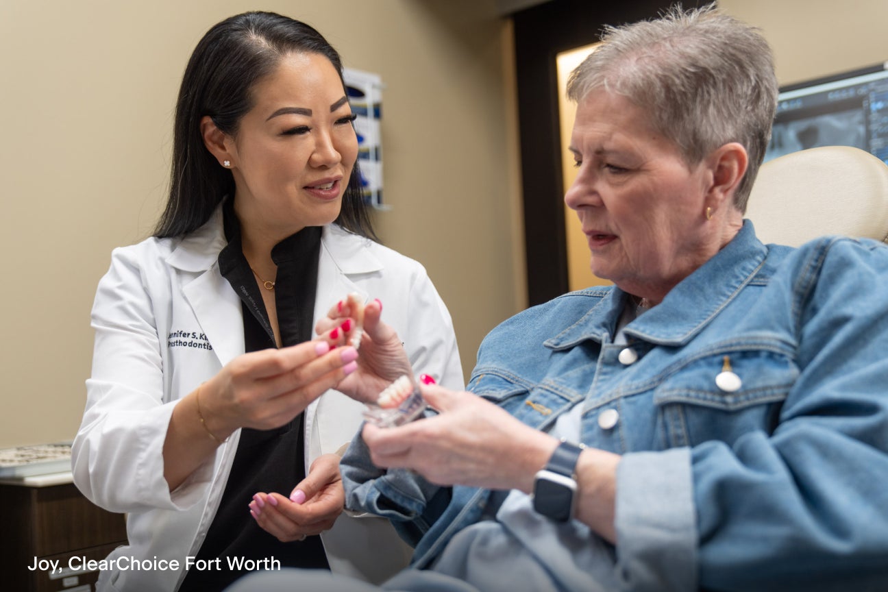 A ClearChoice doctor and patient discussing implant denture procedure.