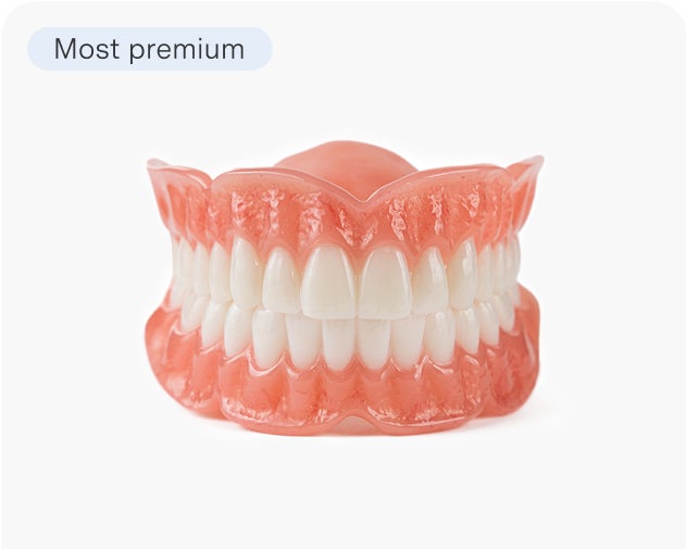 A set of Aspen Dental Signature Elite full arch dentures, designed for an ultra-premium fit and natural appearance. The image highlights top-tier denture solutions for complete tooth replacement.
