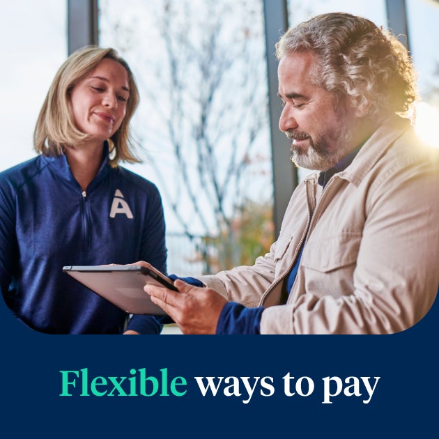 An Aspen Dental professional discussing flexible payment options for the Signature Elite service, emphasizing accessible, high-quality dental care.