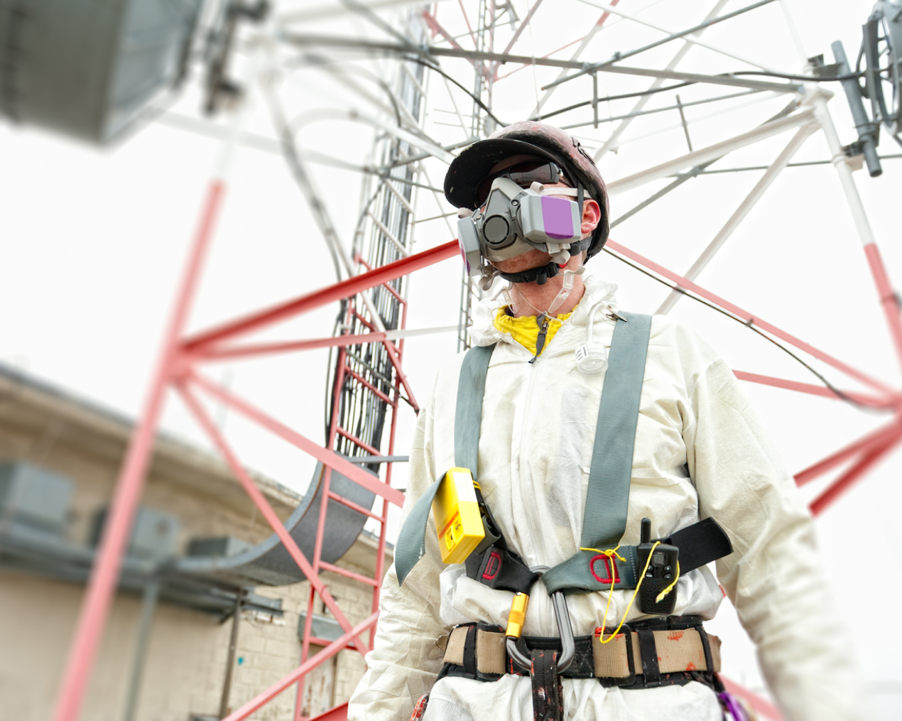  A worker wearing protective clothing and a respirator to stay safe on their job site.