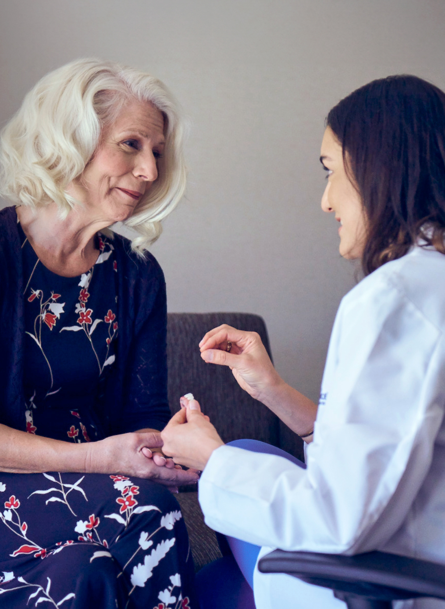 Dr. Parisa Shahi, ClearChoice Prosthodontist, discussing dental bridge options with a patient named Sharon at ClearChoice Riverside. The patient listens attentively during the consultation.