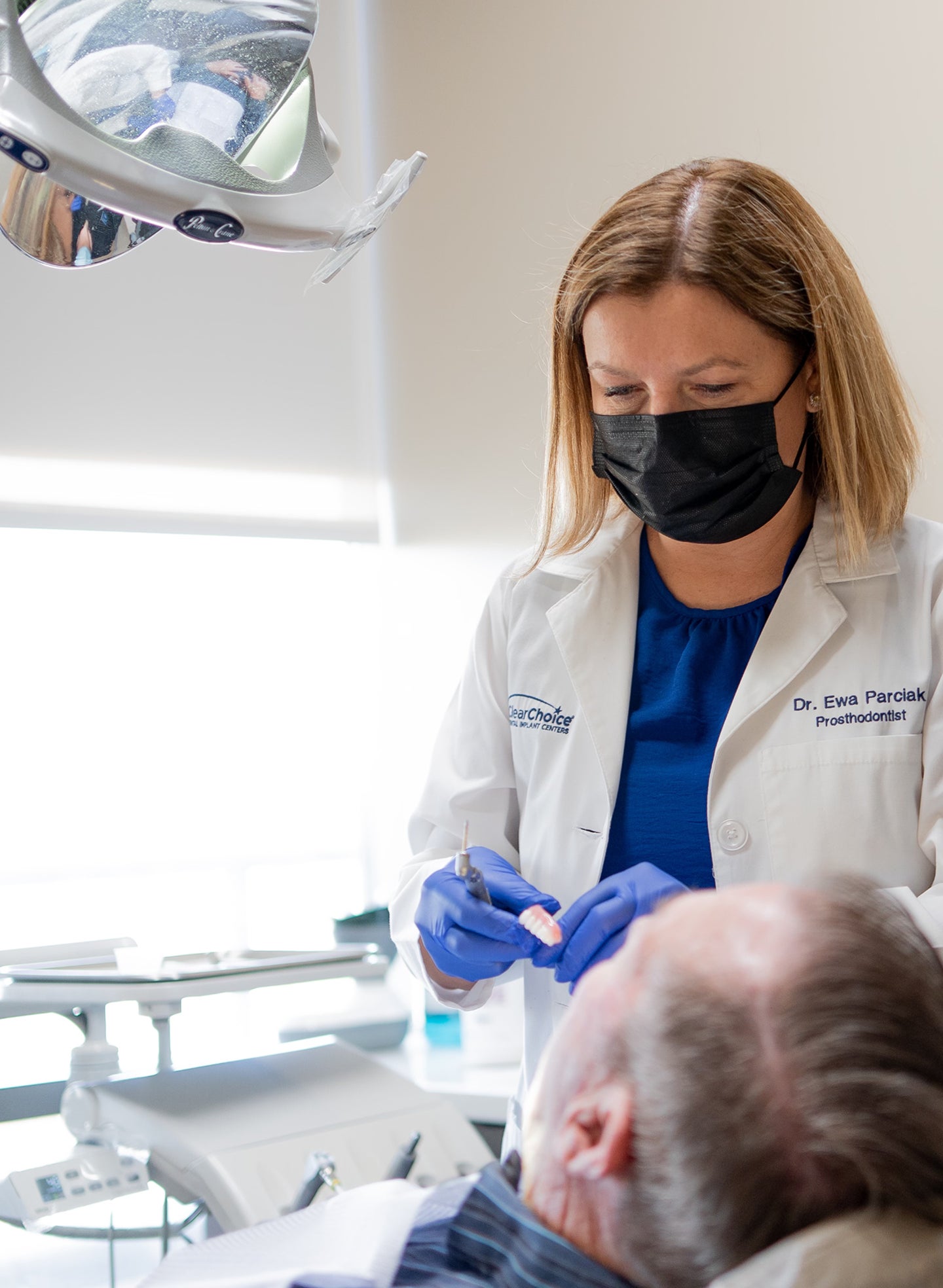 A ClearChoice doctor helping a patient who has avoided the dentist for years to relieve dental anxiety by addressing his concerns and providing him with ways to manage anxiety.