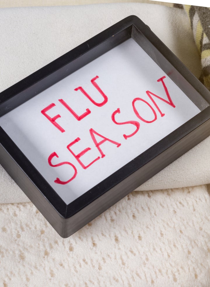 A picture frame with the words "Flu Season" written on it.