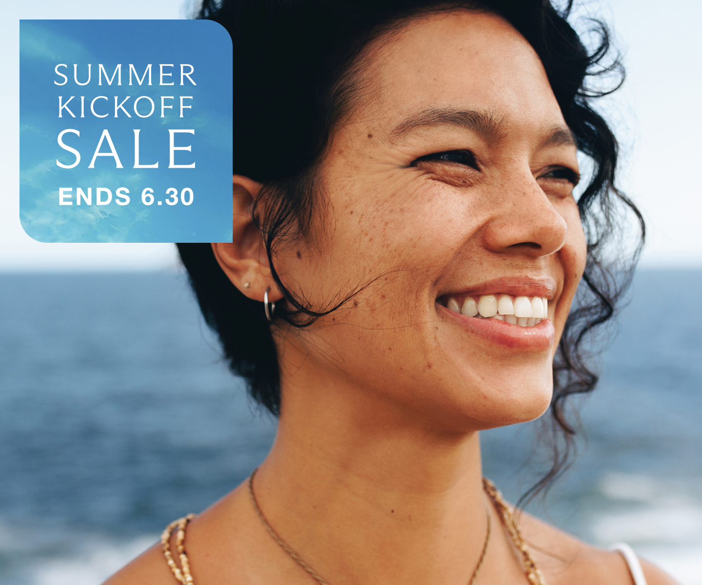 Woman smiling outdoors with smooth, expressive skin—highlighting Chapter’s summer kickoff sale on Xeomin wrinkle treatments. Summer Kickoff Sale ends 6.30.