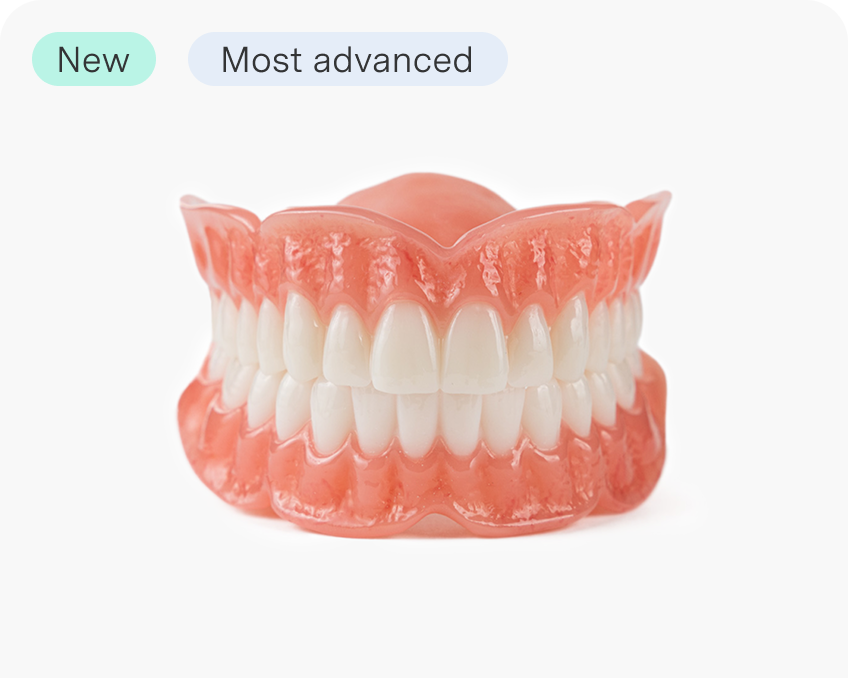 A set of Aspen Dental Signature Elite full arch dentures, designed for an ultra-premium fit and natural appearance. The image highlights top-tier denture solutions for complete tooth replacement.