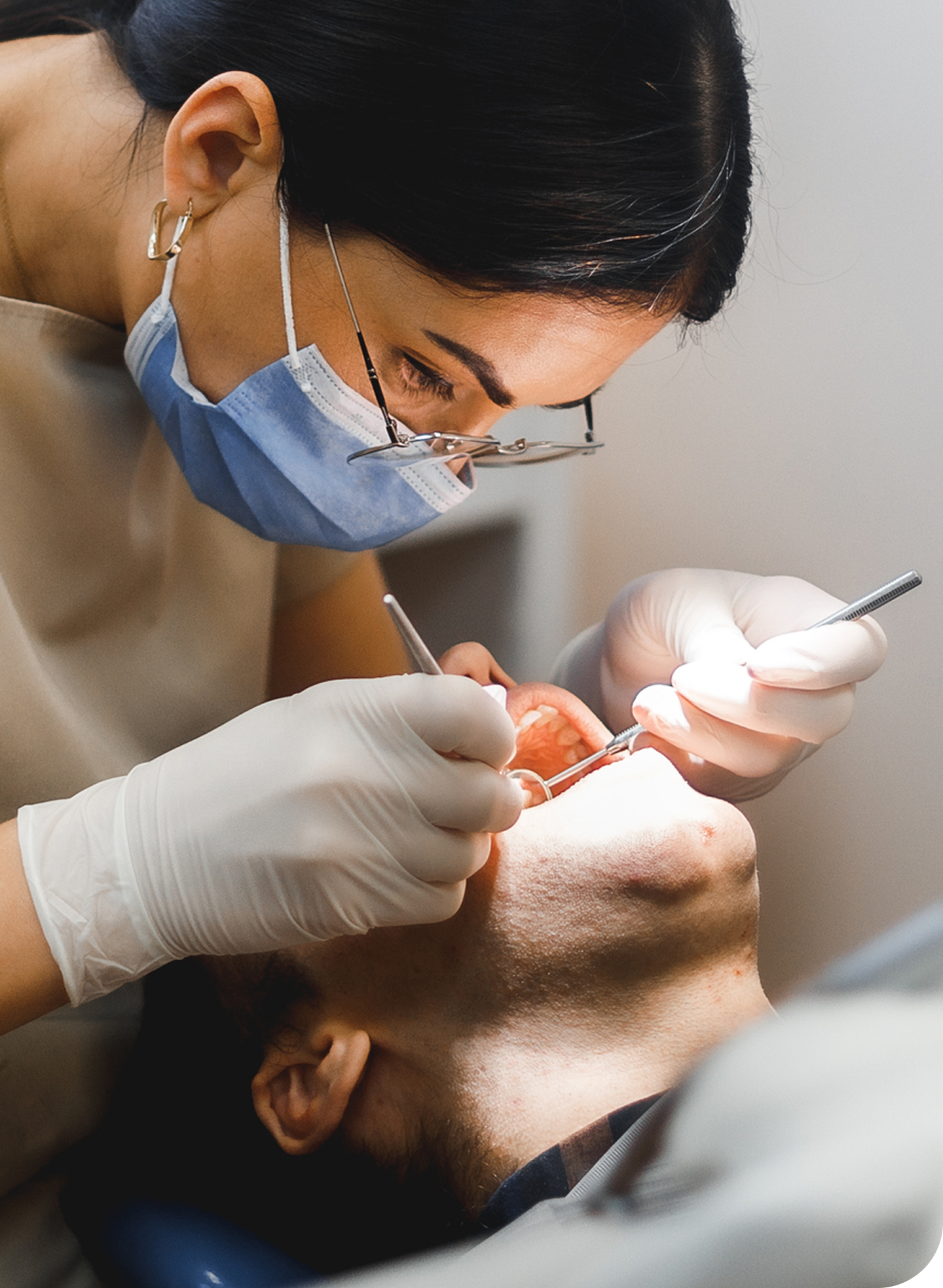 Aspen Dental hygienist performing a professional dental cleaning to treat black teeth stains and assess causes and risks. Preventive care helps reduce discoloration and supports long-term oral health.