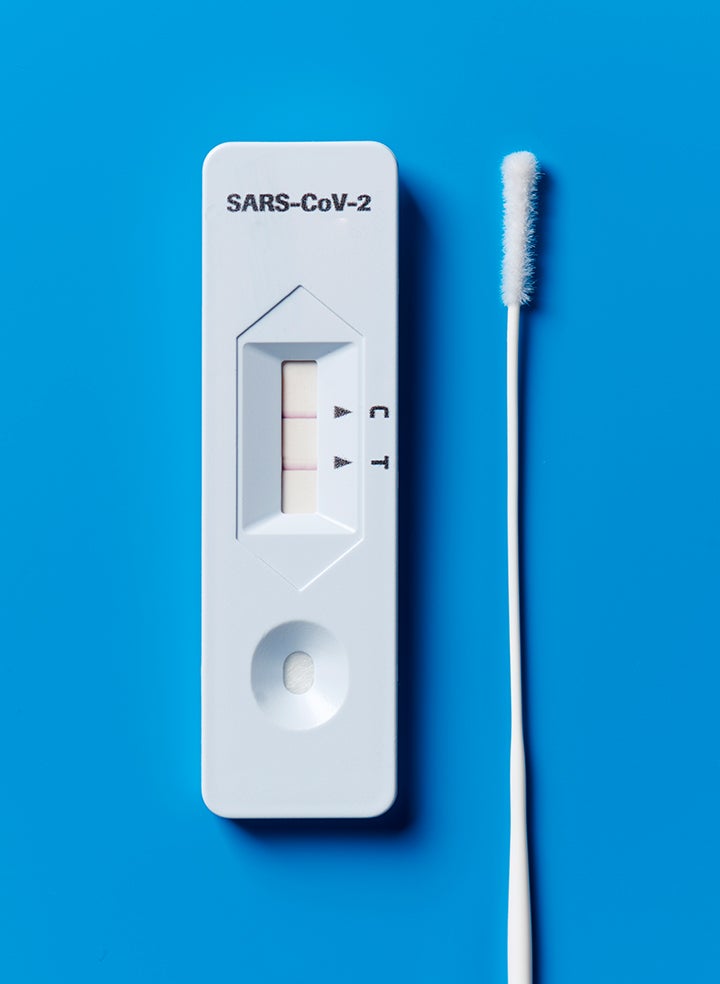 A COVID-19 testing kit showing a positive result. 