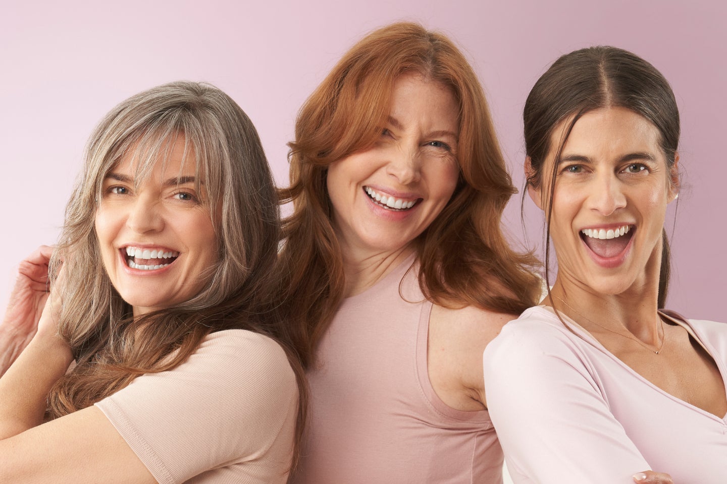Three women gathering and smiling, promoting the benefits of joining the Chapter Rewards Club.