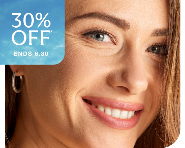 Smiling woman with smooth skin and soft expression lines—showcasing the results of Xeomin wrinkle treatments at Chapter. Summer Kickoff Sale ends 6.30.
