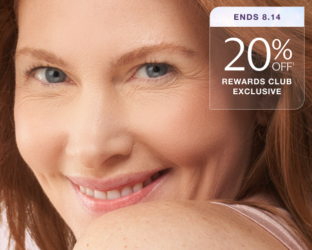Close-up of a smiling woman with smooth, youthful skin and text that reads “20% Off – Rewards Club Exclusive, Ends 8.14.” Reveal brighter skin with laser facial treatments.