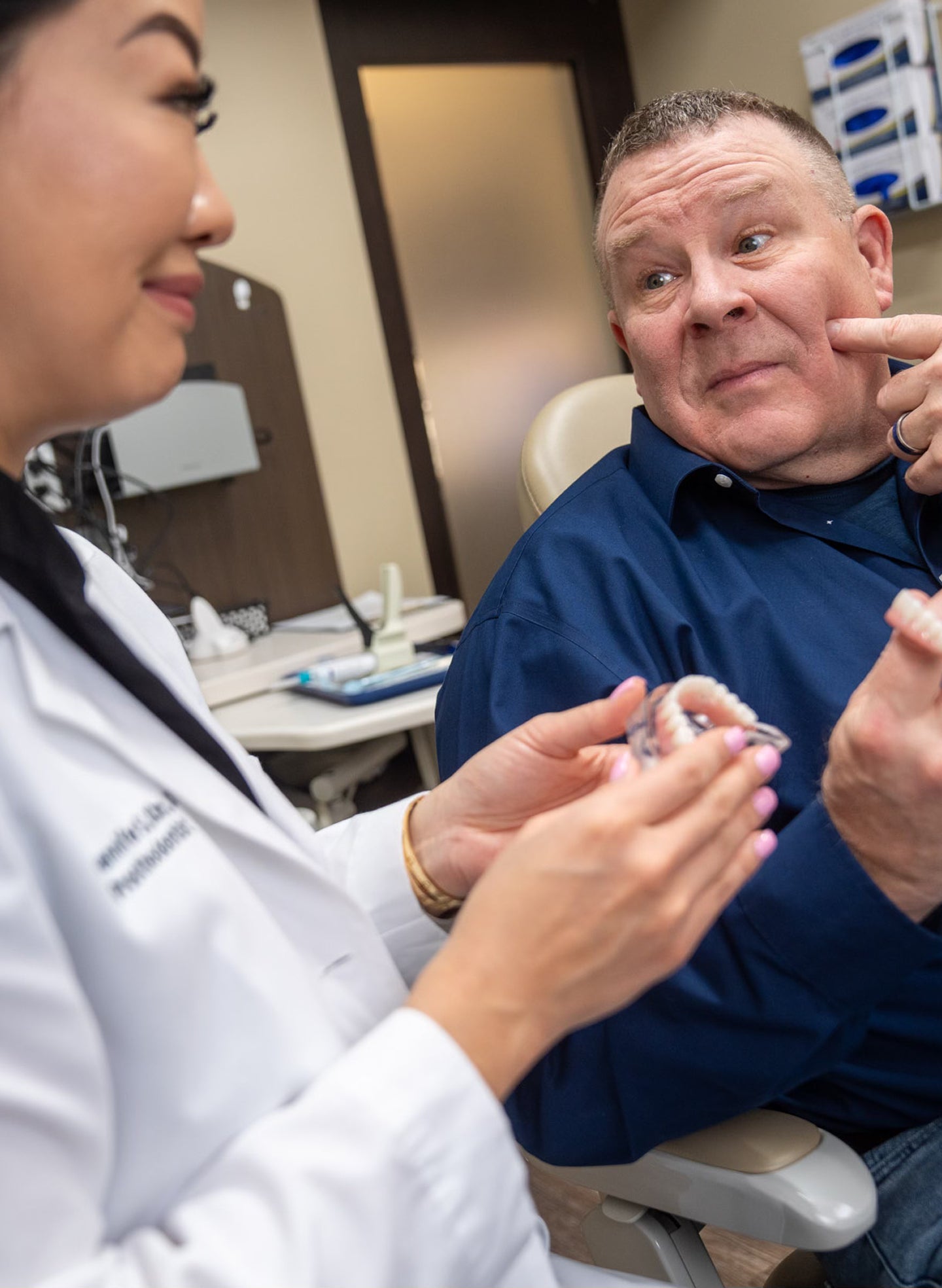 A ClearChoice doctor explaining to her patient about dental implants benefits, success rate, and what to expect for the procedure.