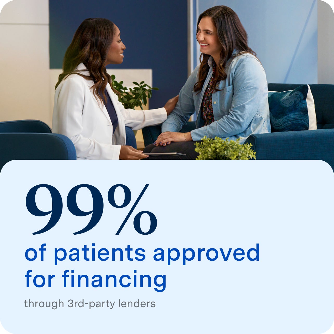 A dental professional and a patient sit together in a welcoming office environment, smiling and discussing treatment options. The Aspen Dental ad highlights that 99% of patients are approved for financing through third-party lenders.