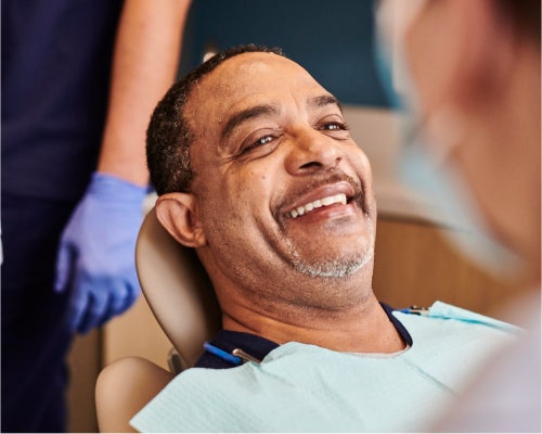 A relaxed patient smiling in a dental chair, showcasing a stress-free visit at Aspen Dental.
image name: aspen-dental-outdoor-consultation