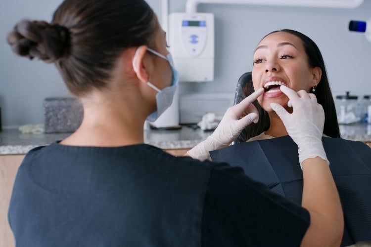 A ClearChoice administering  the beginning stages of periodontitis treatment.