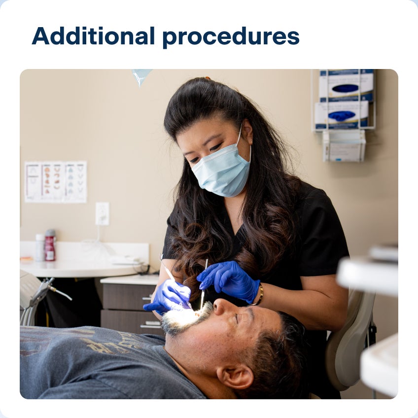 An image of a ClearChoice doctor performing additional procedures, such as a bone graft or an extraction, for a patient prior to his dental implant treatment.
