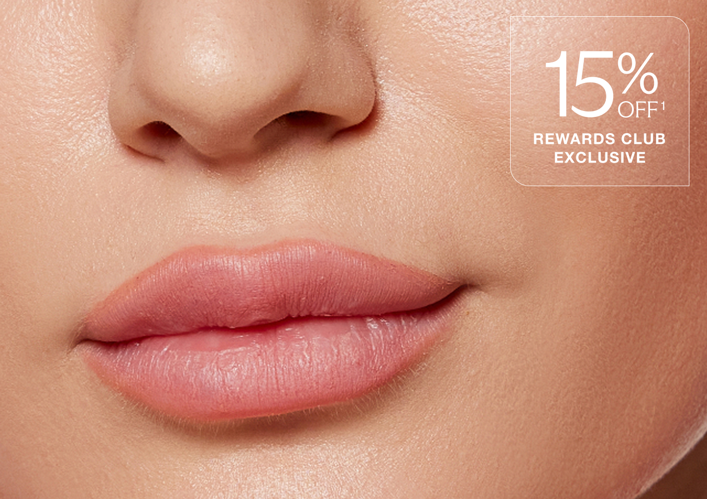 A close up of a woman's lips after receiving filler treatment at Chapter Aesthetic Studio, with the text "15% off rewards club exclusive" overlaid