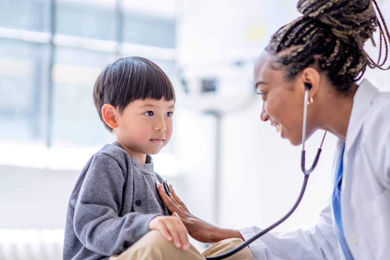 A doctor examining a young child.