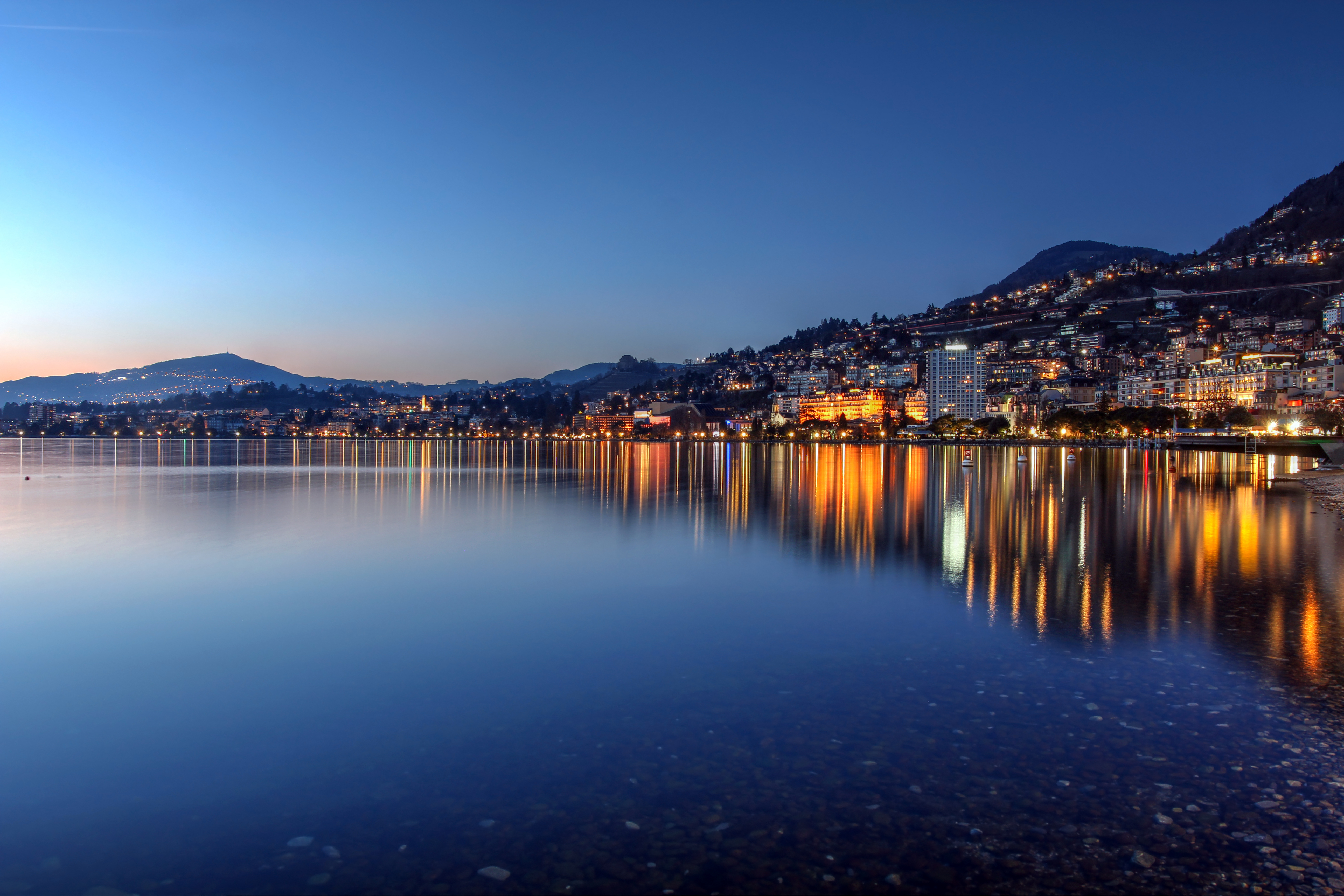 Sunset view of Montreux city in Switzerland from the embankment along Lake Geneva