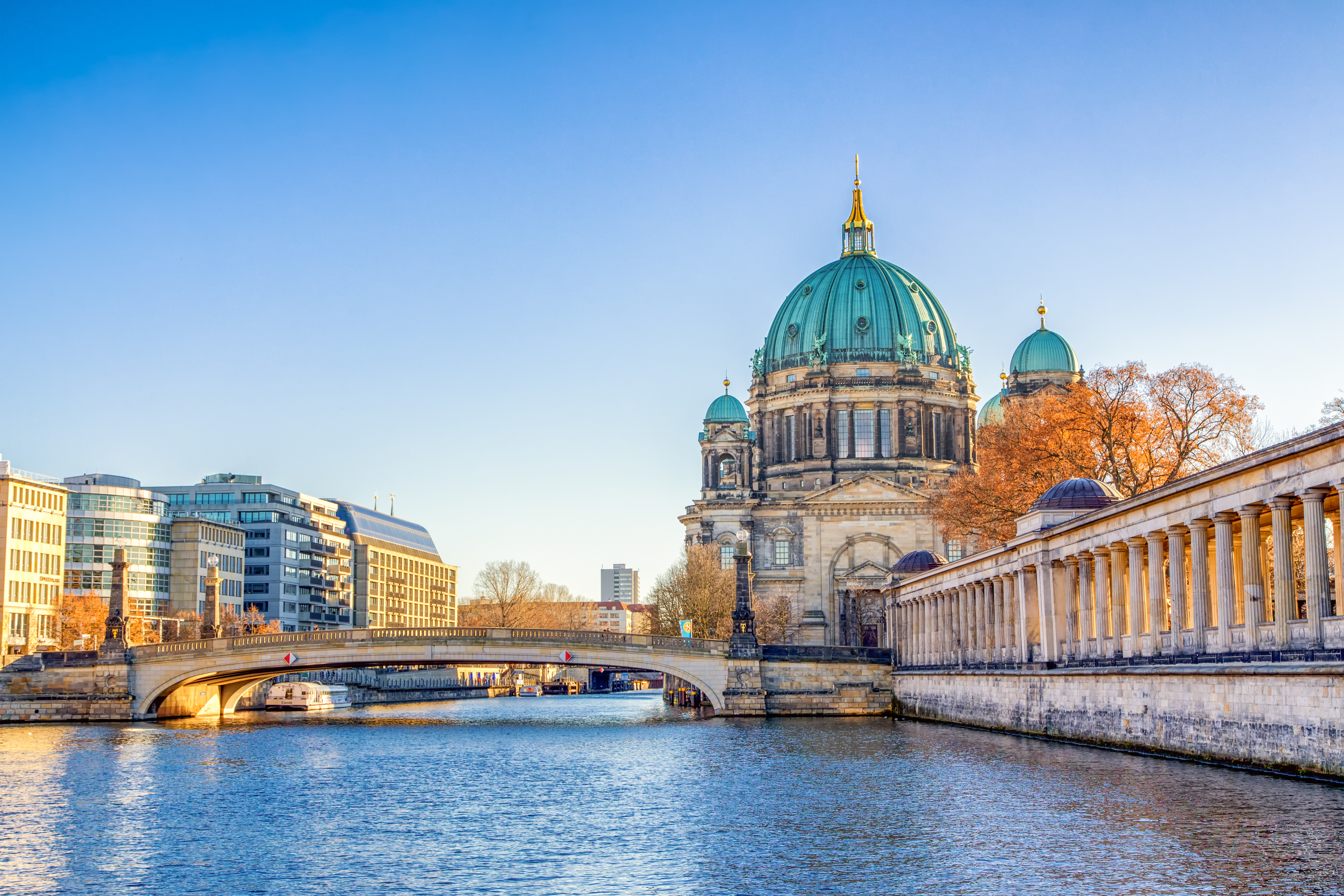Berlin Cathedral (Berliner Dom) surrounded by lush gardens and situated near the Spree River in Germany