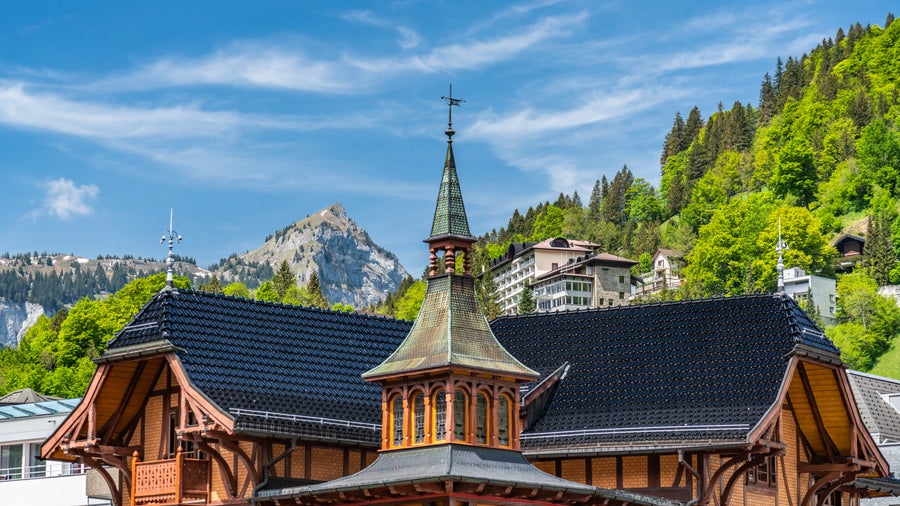 Traditional wooden Swiss chalet in the mountains of Engelberg, Switzerland, surrounded by alpine scenery