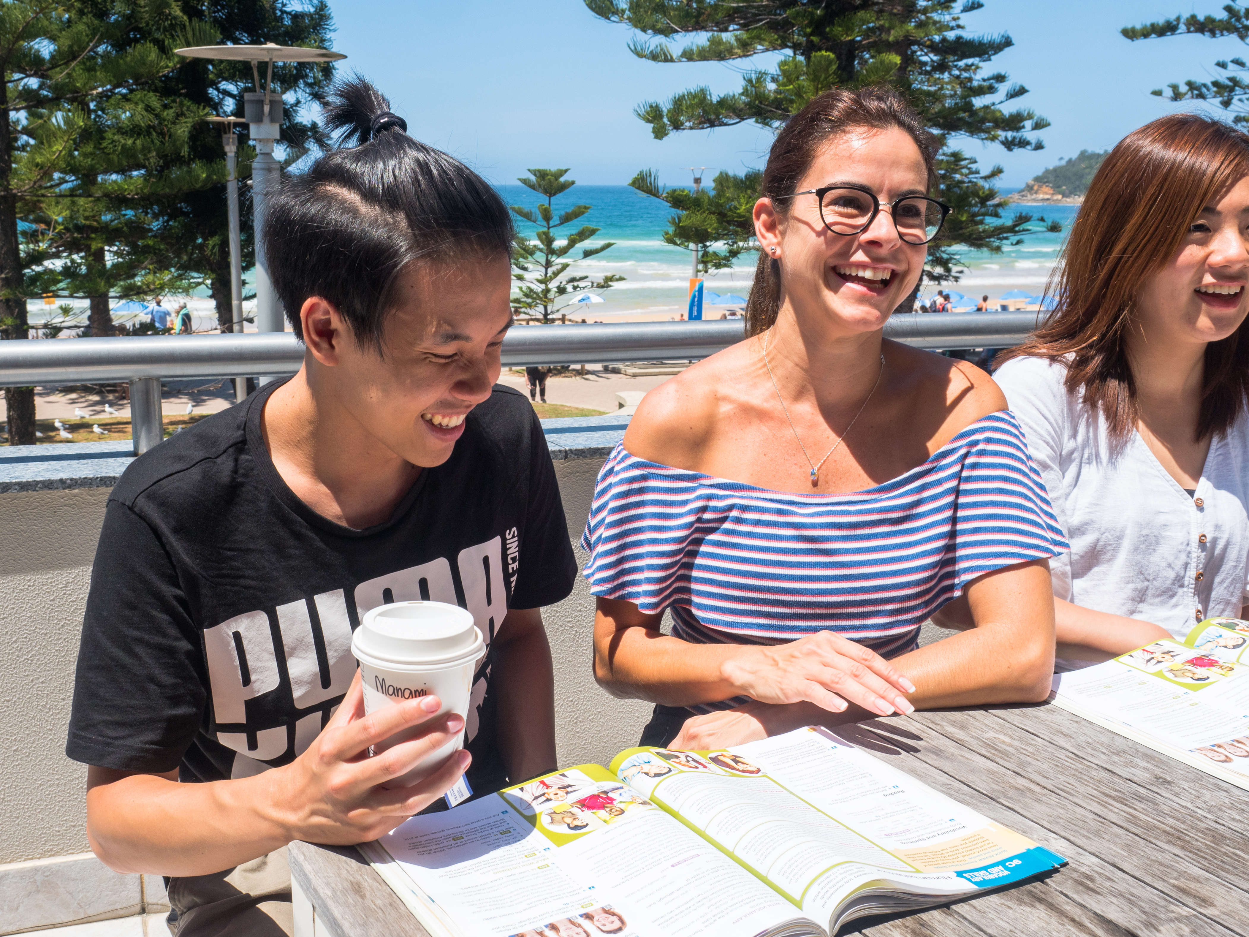 Three students during a lesson in the balcony at Lexis Sydney
