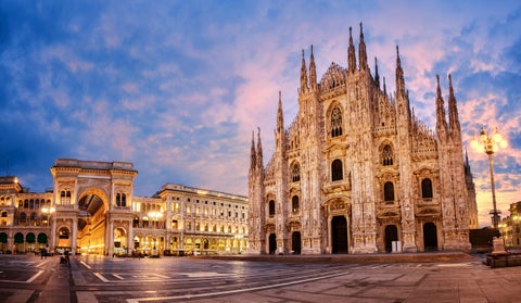 Duomo Square featuring Duomo di Milano Cathedral and Galleria Vittorio Emanuele II at sunset in Milano, Italy