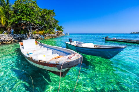 Boats in the clear Caribbean Sea near Cartagena, Colombia
